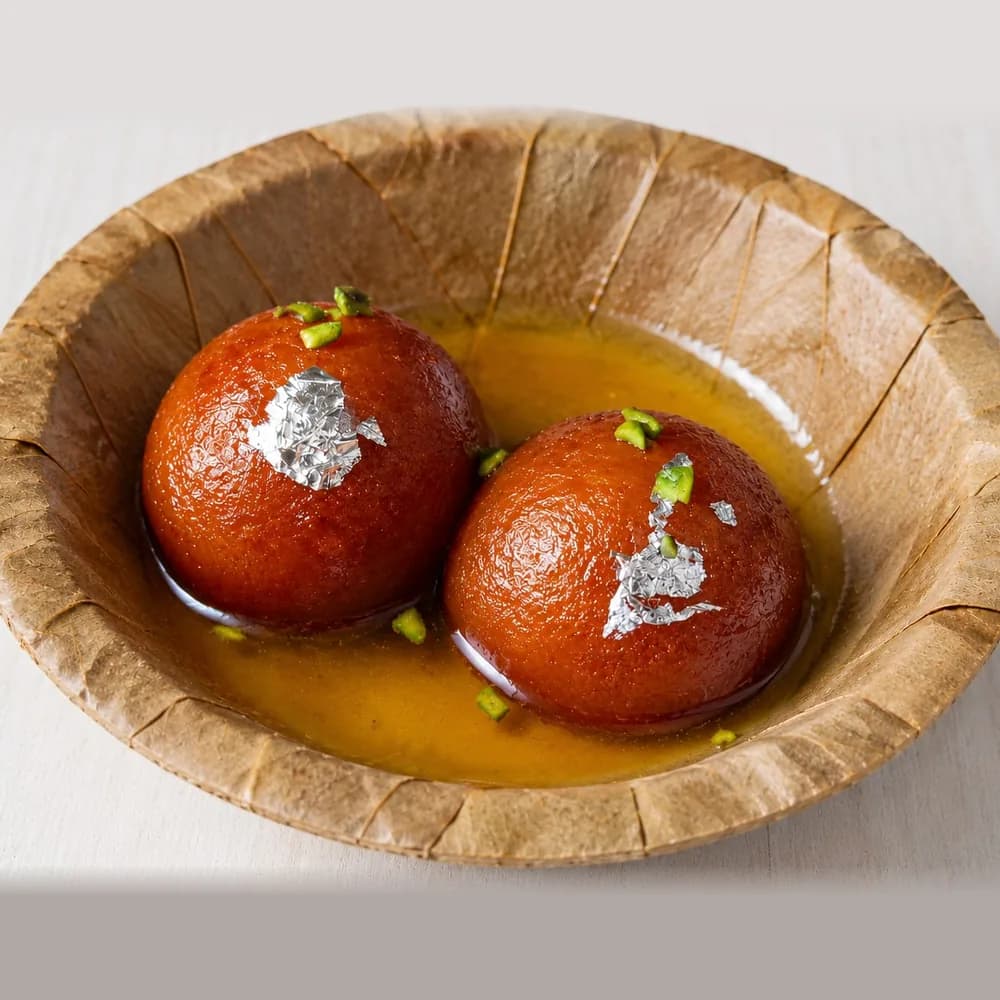 Gulab Jamun, served on a leaf pattal
